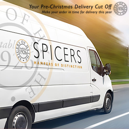 Spicers of Hythe delivery van driving on a road.