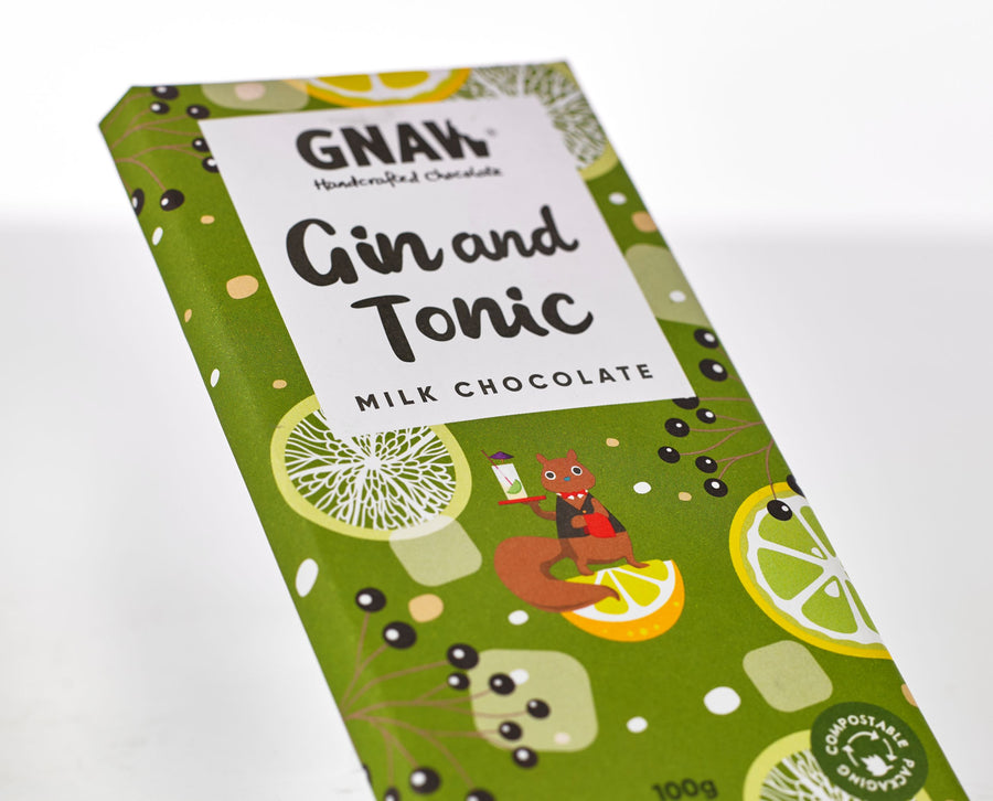 A close up of the Gin & Tonic Milk Chocolate bar from Gnaw. In bold green and yellow colouring it also depicts a Squirrell serving a gin and tonic while stood on top of a lemon. 